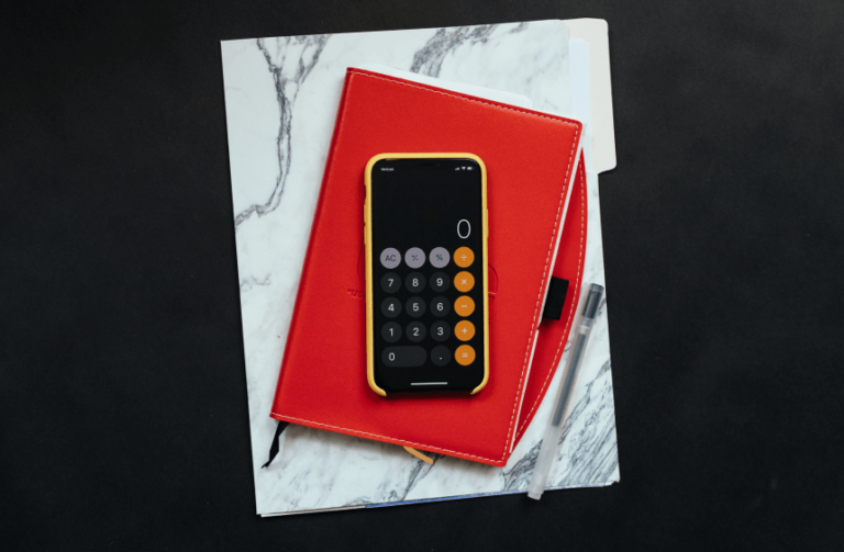 iPhone calculator on red notebook